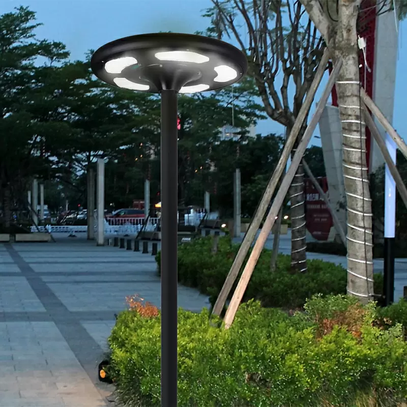 Round solar garden light with integrated panel and post mount